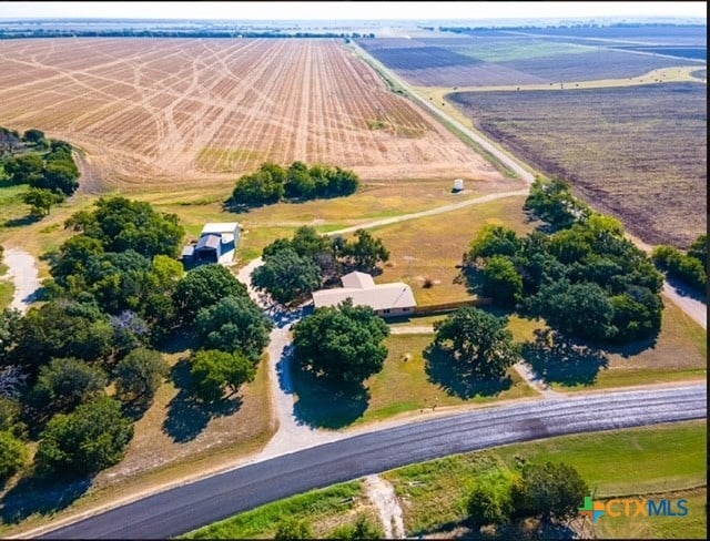 birds eye view of property with a rural view