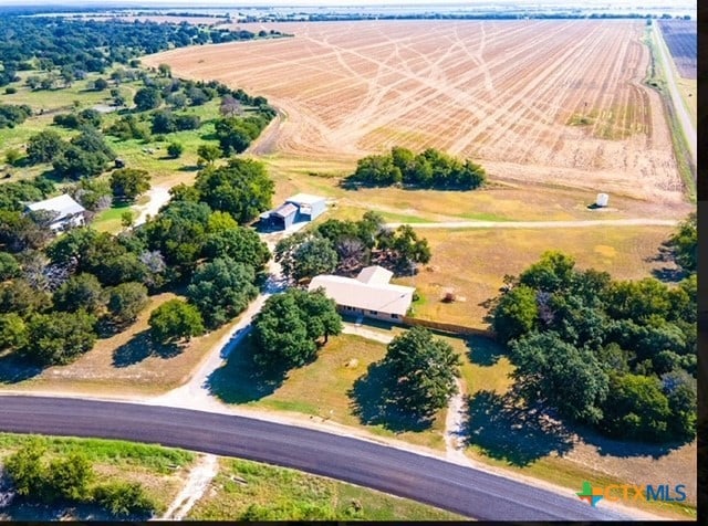 birds eye view of property with a rural view