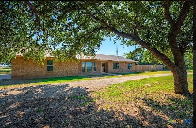 rear view of house with a lawn