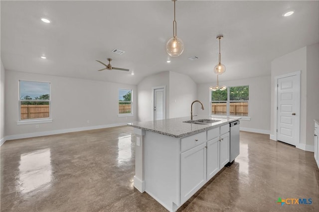 kitchen with a sink, finished concrete floors, baseboards, and visible vents
