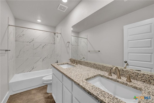 full bathroom featuring toilet, visible vents, shower / tub combination, and a sink