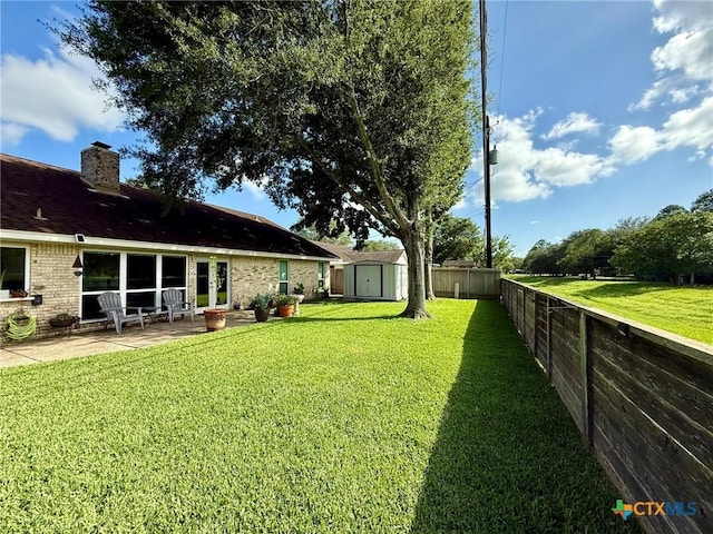 107 Savannah Dr, Victoria, TX 77904 - fenced backyard featuring a shed and a patio area