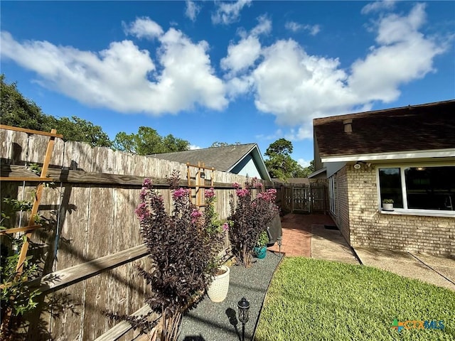 107 Savannah Dr, Victoria, TX 77904 - fenced backyard featuring a patio area