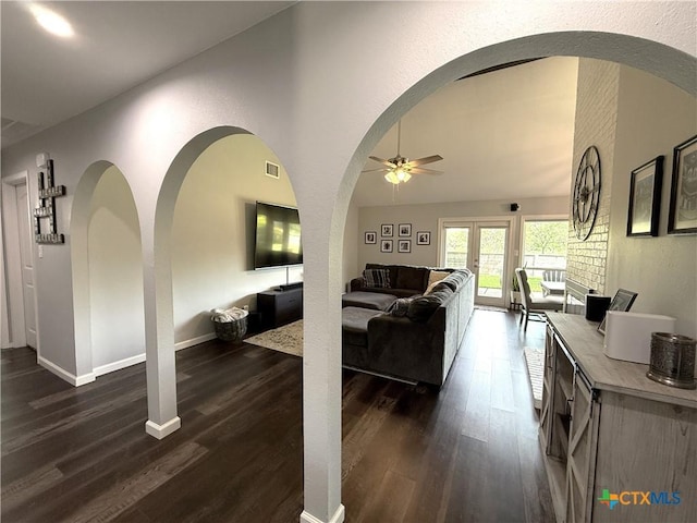 107 Savannah Dr, Victoria, TX 77904 - living room featuring a ceiling fan, dark wood-style flooring, and arched walkways