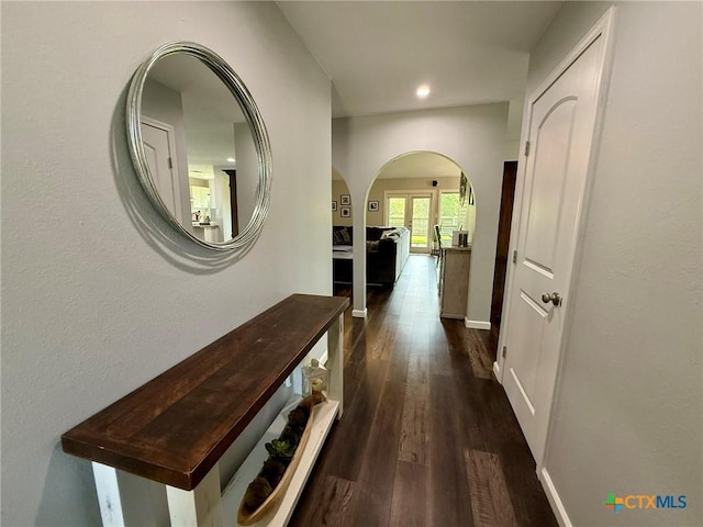 107 Savannah Dr, Victoria, TX 77904 - hall featuring arched walkways, dark wood-style flooring, and recessed lighting
