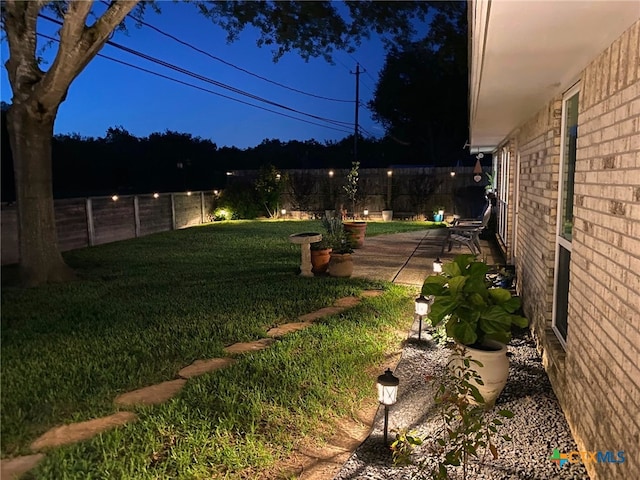 107 Savannah Dr, Victoria, TX 77904 - fenced backyard featuring a patio area