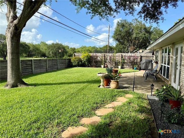 107 Savannah Dr, Victoria, TX 77904 - fenced backyard with a patio