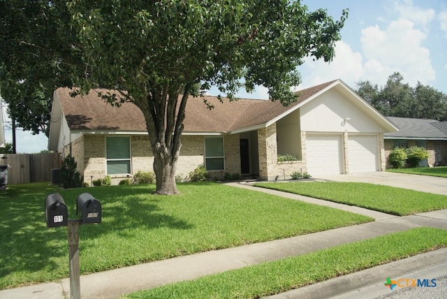 107 Savannah Dr, Victoria, TX 77904 - single story home featuring a garage, driveway, brick siding, and a shingled roof