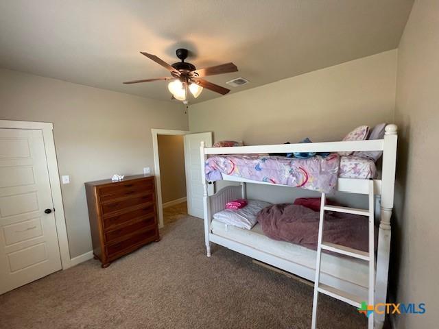 5618 County Road 3300, Kempner, TX 76539 - bedroom featuring carpet, a ceiling fan, and baseboards