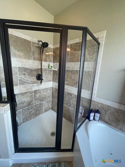 5618 County Road 3300, Kempner, TX 76539 - full bath with a whirlpool tub, a stall shower, and lofted ceiling