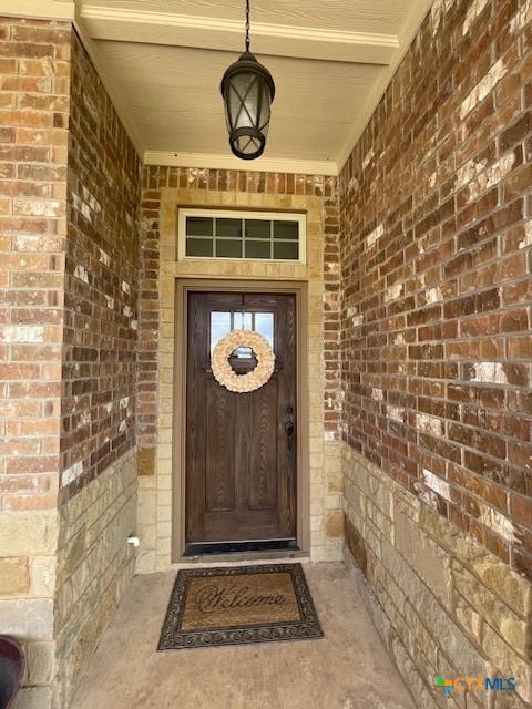 5618 County Road 3300, Kempner, TX 76539 - doorway to property featuring brick siding