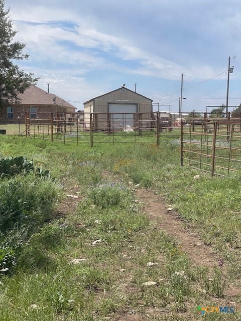 5618 County Road 3300, Kempner, TX 76539 - view of yard featuring a detached garage, an outbuilding, and a rural view