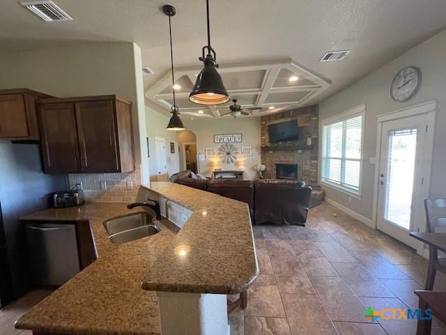 5618 County Road 3300, Kempner, TX 76539 - kitchen featuring a sink, a fireplace, ceiling fan, coffered ceiling, and a peninsula