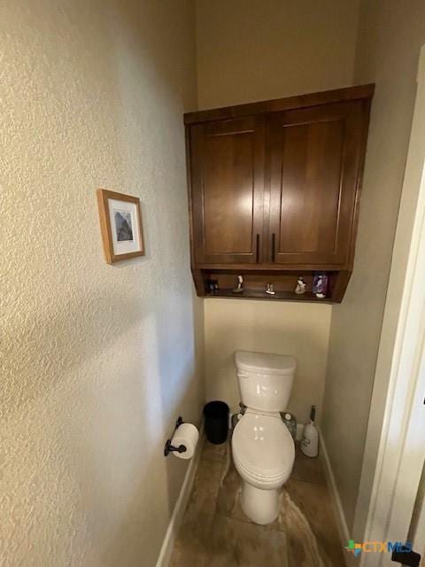 5618 County Road 3300, Kempner, TX 76539 - bathroom with baseboards and toilet