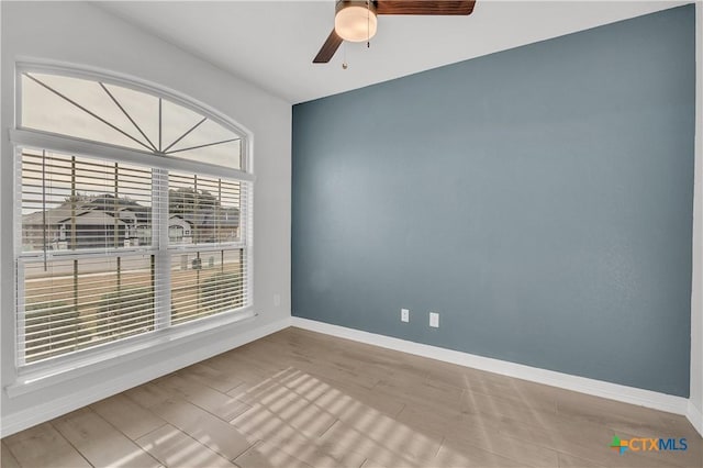 unfurnished room featuring ceiling fan