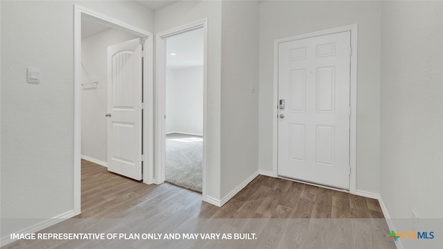 foyer with light wood-type flooring