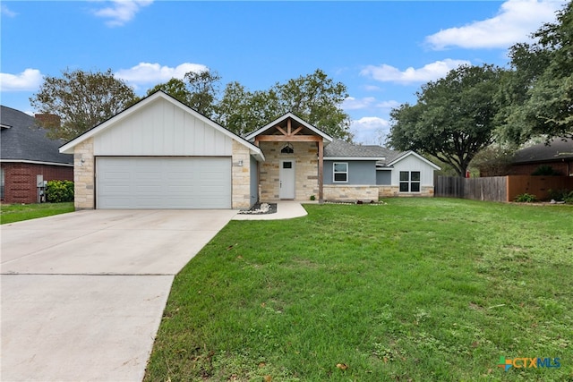 view of front of home featuring a garage and a front yard