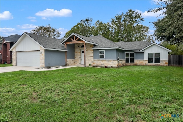 view of front of home with a garage and a front yard