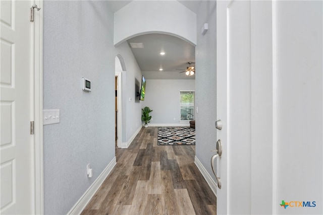 hall with wood-type flooring