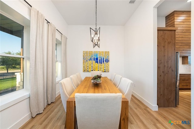 7817 W Fm 487, Florence, TX 76527 - dining room featuring baseboards, a notable chandelier, and light wood-style flooring