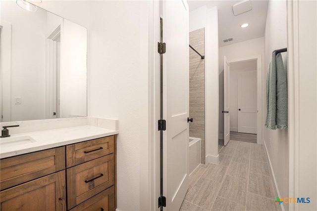 7817 W Fm 487, Florence, TX 76527 - bathroom featuring vanity, visible vents, recessed lighting, washtub / shower combination, and baseboards
