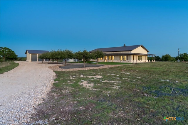 7817 W Fm 487, Florence, TX 76527 - view of yard featuring an outdoor structure, a garage, and gravel driveway