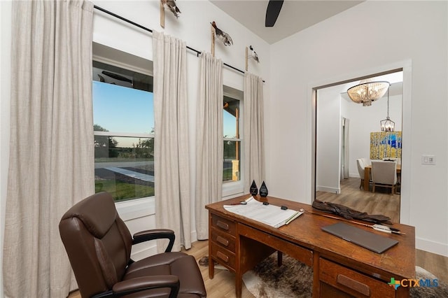 7817 W Fm 487, Florence, TX 76527 - home office featuring a chandelier and wood finished floors