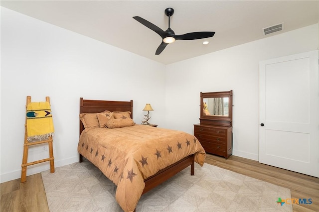 7817 W Fm 487, Florence, TX 76527 - bedroom featuring light wood-style floors, visible vents, baseboards, and recessed lighting