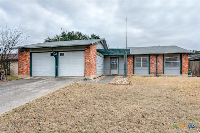 ranch-style home with a garage and a front yard