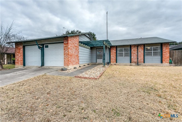 ranch-style house with a garage and a front lawn