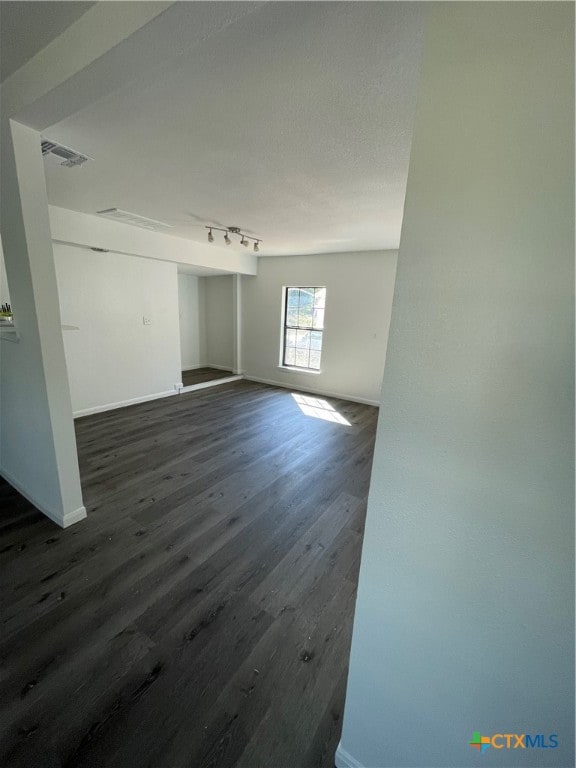 spare room with dark hardwood / wood-style floors