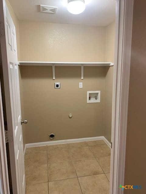 laundry area with visible vents, washer hookup, light tile patterned floors, hookup for an electric dryer, and laundry area