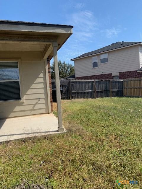 view of yard with a patio area and fence