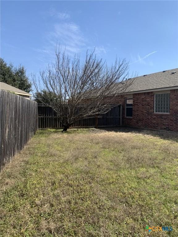 view of yard with fence