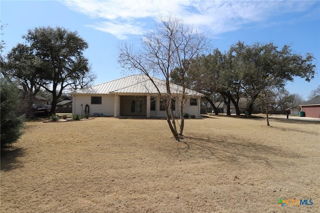 back of property with metal roof