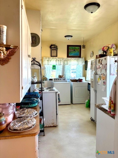 clothes washing area featuring independent washer and dryer