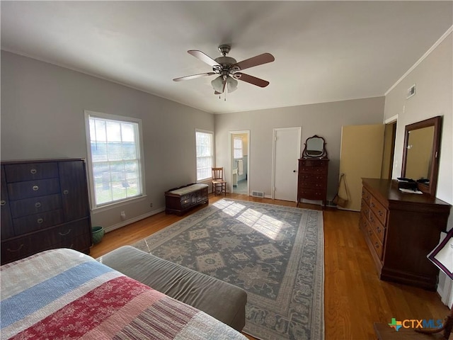 bedroom with ceiling fan and hardwood / wood-style flooring