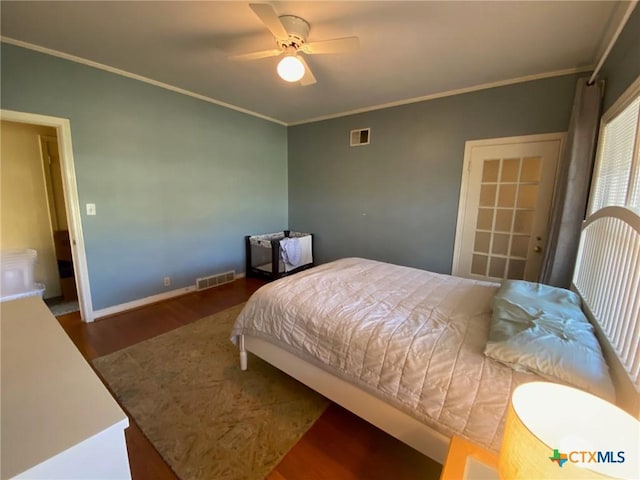 bedroom with dark hardwood / wood-style flooring, ceiling fan, and crown molding