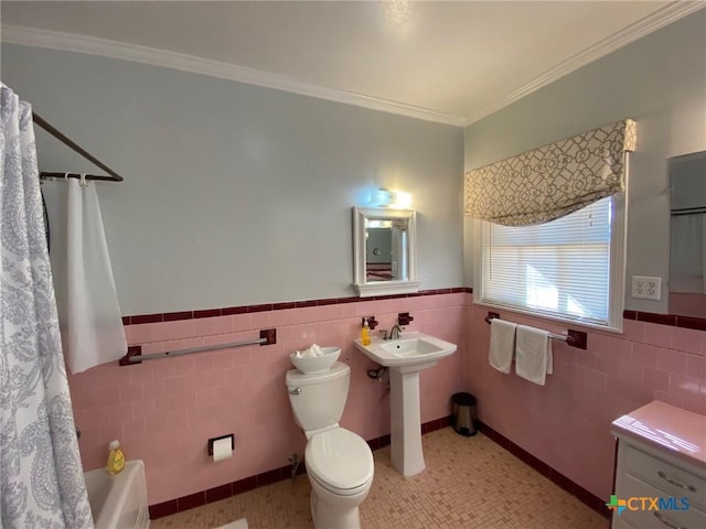 full bathroom with tile patterned flooring, toilet, ornamental molding, and tile walls