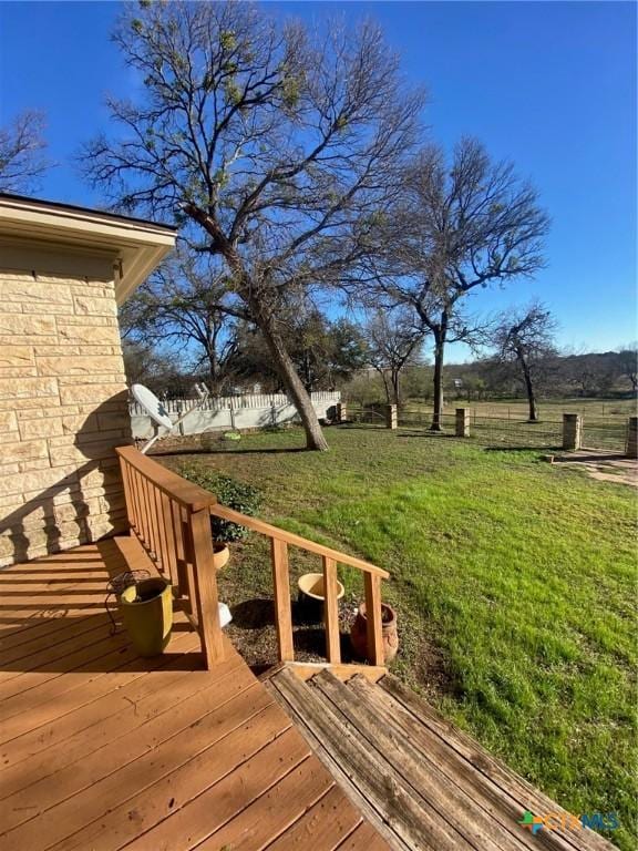 deck featuring a yard