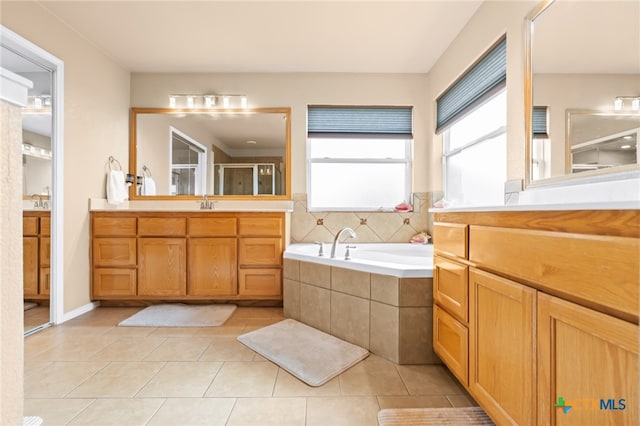 bathroom featuring tile patterned floors, vanity, and independent shower and bath