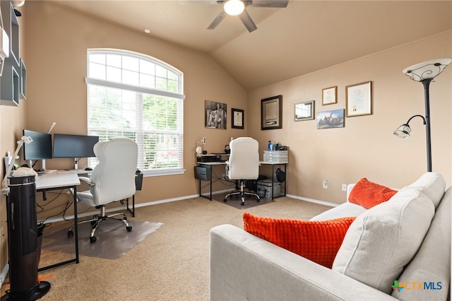 office space featuring carpet flooring, ceiling fan, and vaulted ceiling