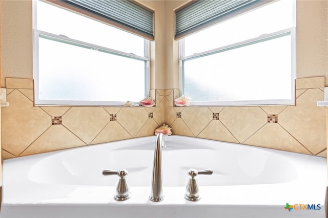 bathroom with a washtub