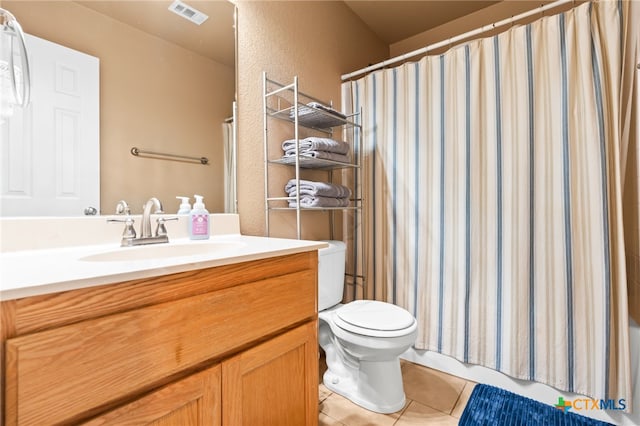 bathroom with tile patterned floors, vanity, toilet, and a shower with shower curtain