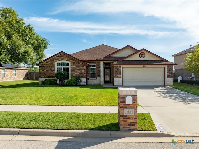 single story home featuring a front yard and a garage