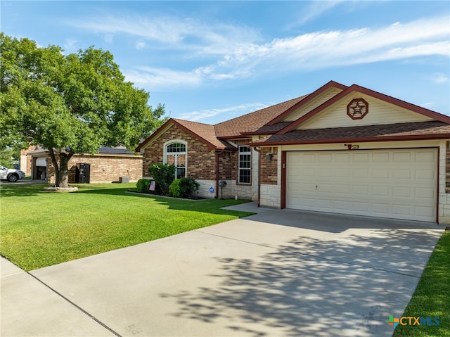 single story home with a front yard and a garage