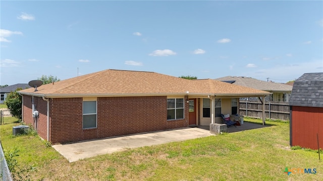 4209 Stallion Dr, Killeen, TX 76549 - rear view of house featuring a patio, brick siding, and a shingled roof