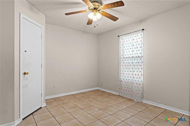 4209 Stallion Dr, Killeen, TX 76549 - spare room with a textured ceiling, light tile patterned floors, and a ceiling fan