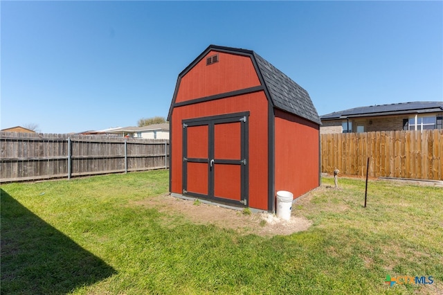 view of shed featuring a fenced backyard