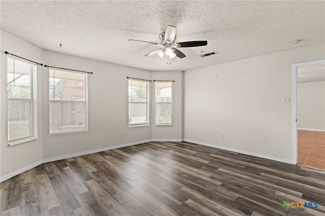 4209 Stallion Dr, Killeen, TX 76549 - empty room featuring plenty of natural light, wood finished floors, ceiling fan, a textured ceiling, and baseboards